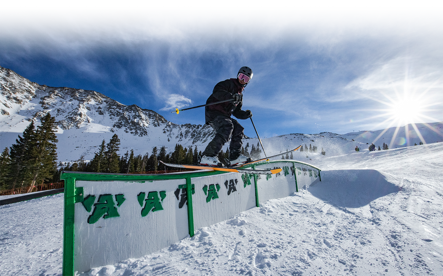 skier hits rail